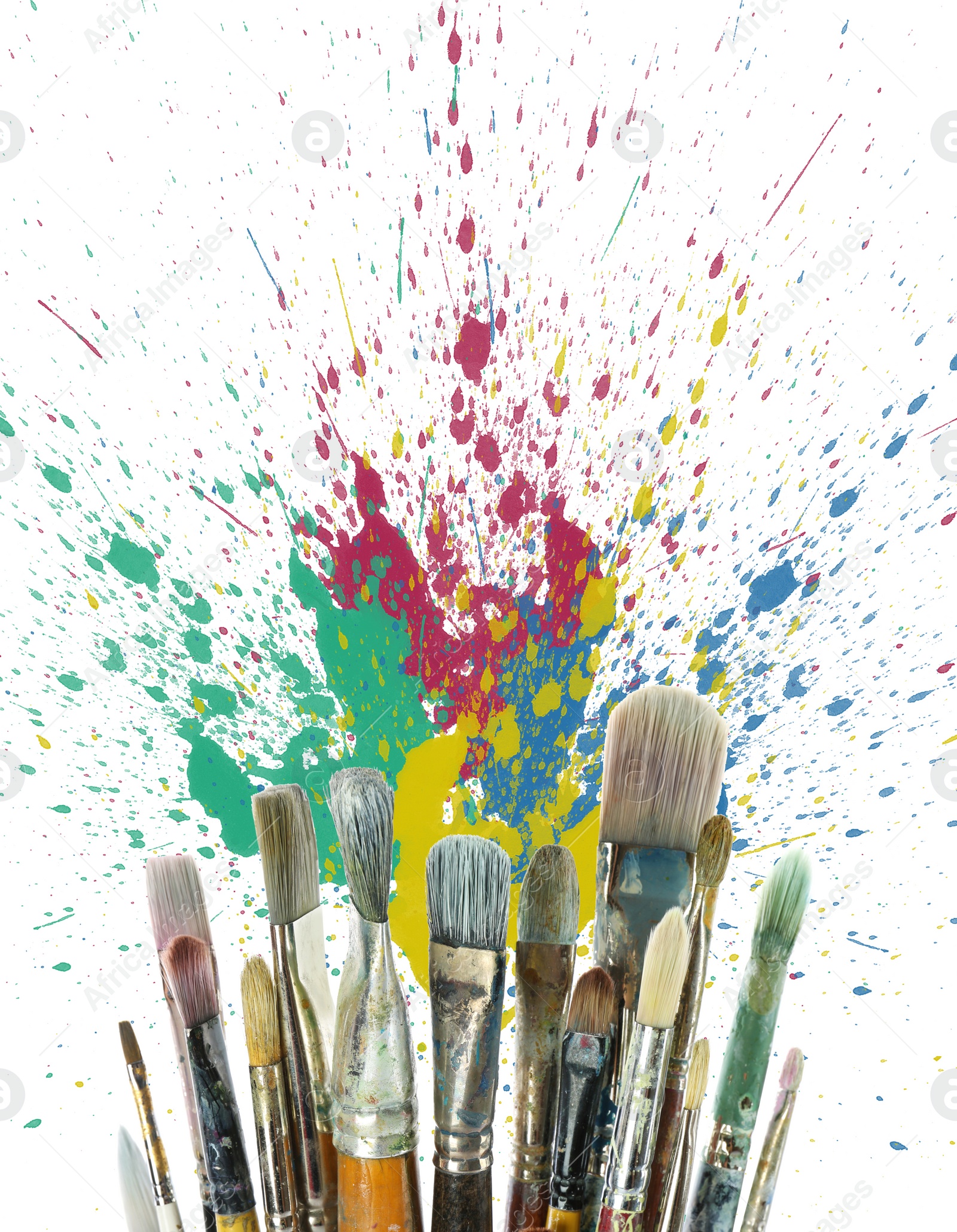 Image of Different brushes and paint splatters on white background