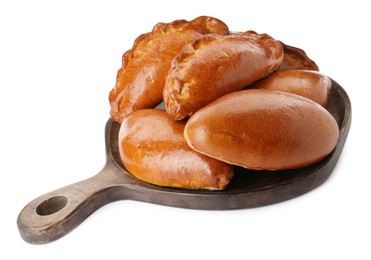 Wooden board with delicious baked patties on white background