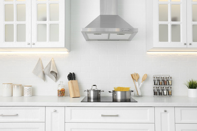 Photo of Beautiful kitchen interior with new stylish furniture