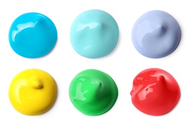 Image of Paint blobs of different colors on white background, top view