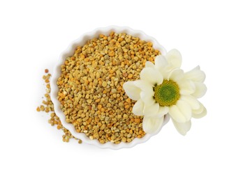 Fresh bee pollen granules in bowl and flower isolated on white, top view