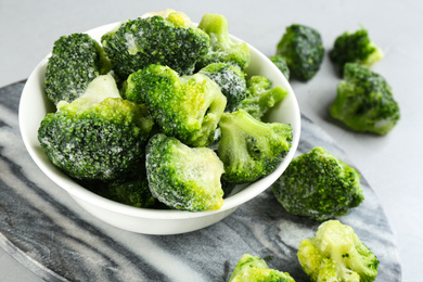 Frozen broccoli florets on table, closeup. Vegetable preservation