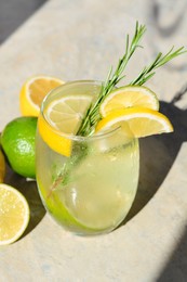 Tasty refreshing lemonade and ingredients on light table. Summer drink