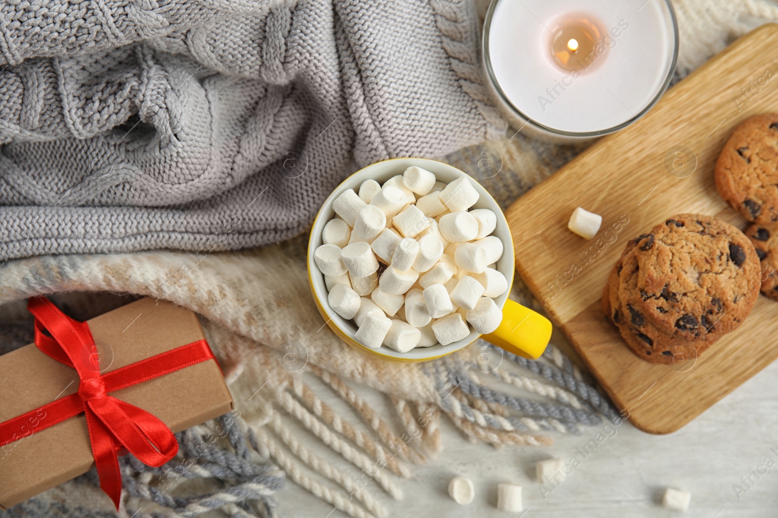 Photo of Cup of hot cocoa with marshmallows on table, flat lay. Winter drink