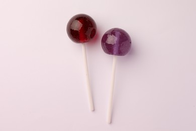 Photo of Tasty lollipops on white background, flat lay