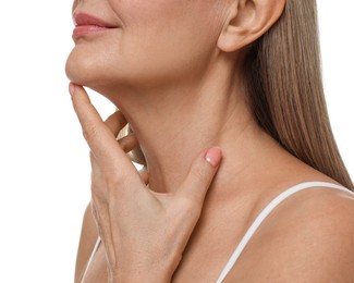 Mature woman touching her neck on white background, closeup