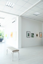 Photo of Empty hall of modern art gallery with exhibits