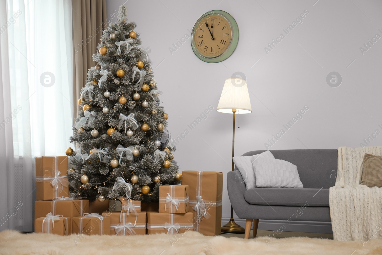 Photo of Decorated Christmas tree in modern living room interior