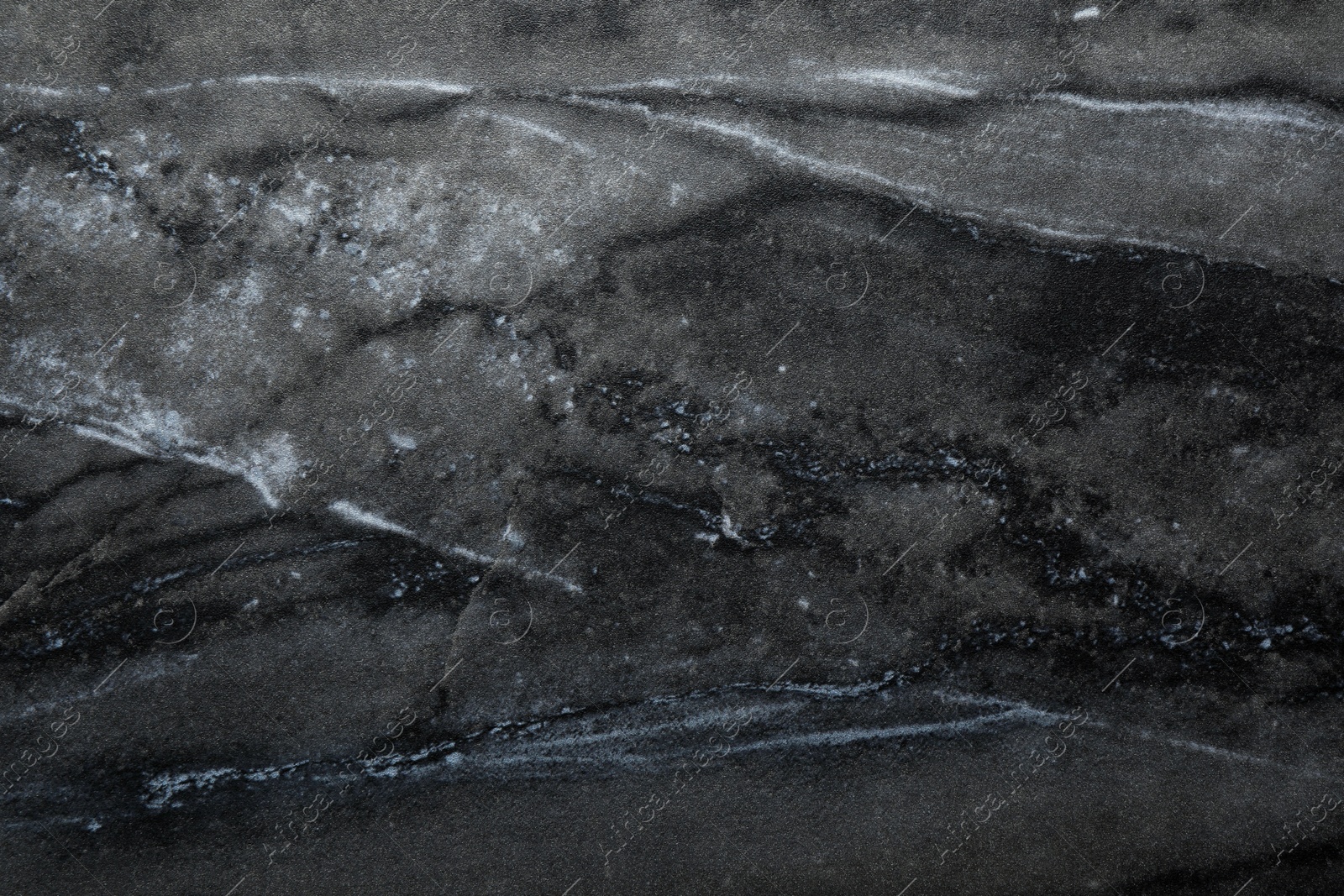 Image of Texture of black marble stone surface as background, closeup