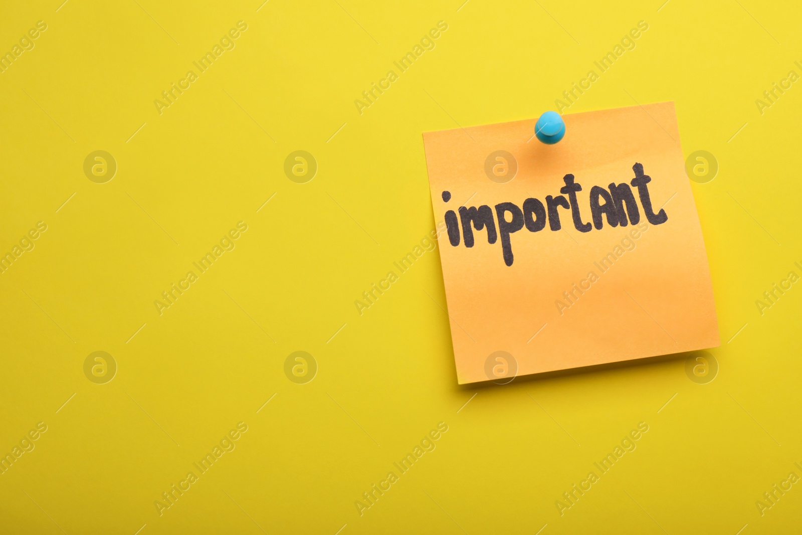 Photo of Paper note with word Important pinned on yellow background, space for text