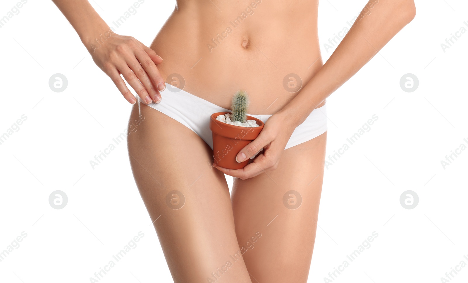 Photo of Woman with cactus showing smooth skin after bikini epilation on white background, closeup. Body care concept