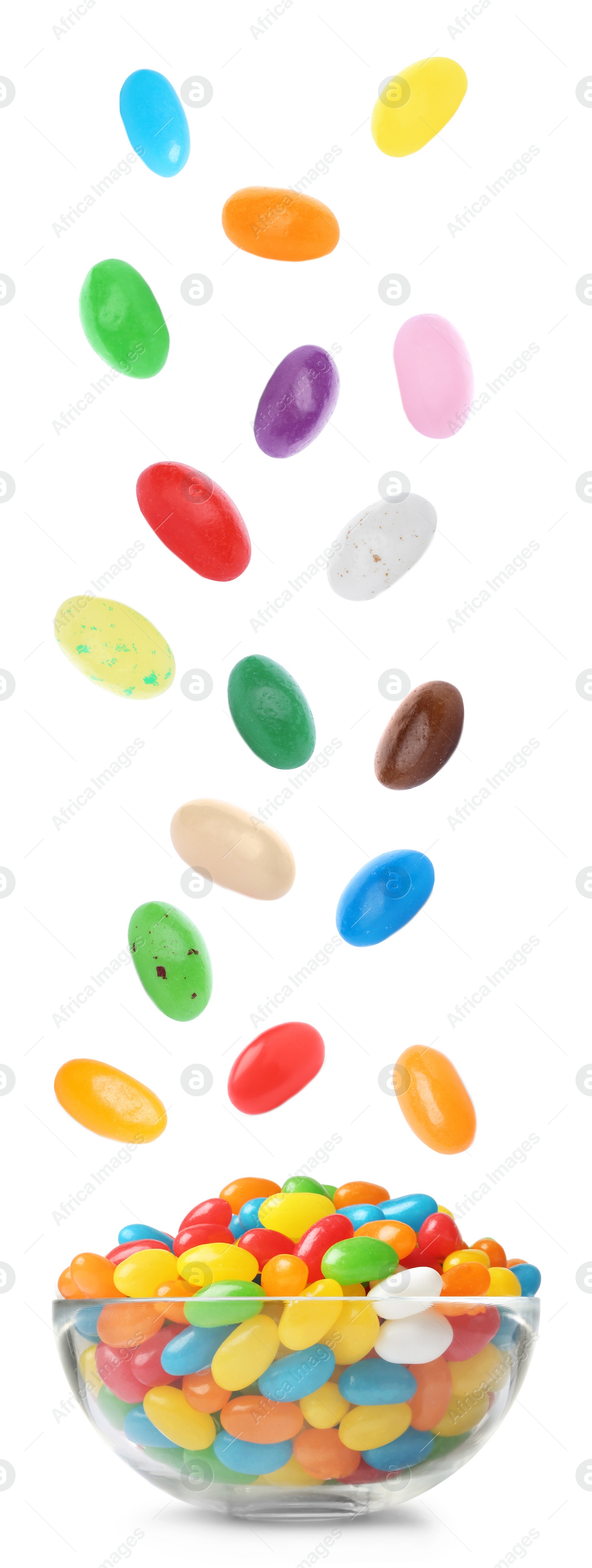 Image of Delicious jelly candies falling into glass bowl on white background