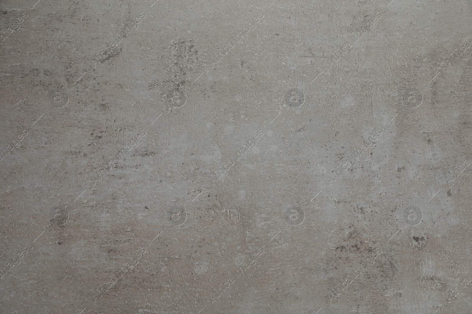 Photo of Texture of light grey stone surface as background, closeup