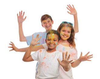Photo of Group of friends covered with colorful powder dyes on white background. Holi festival celebration