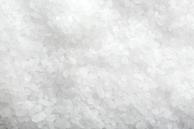 Photo of Natural white salt as background, top view