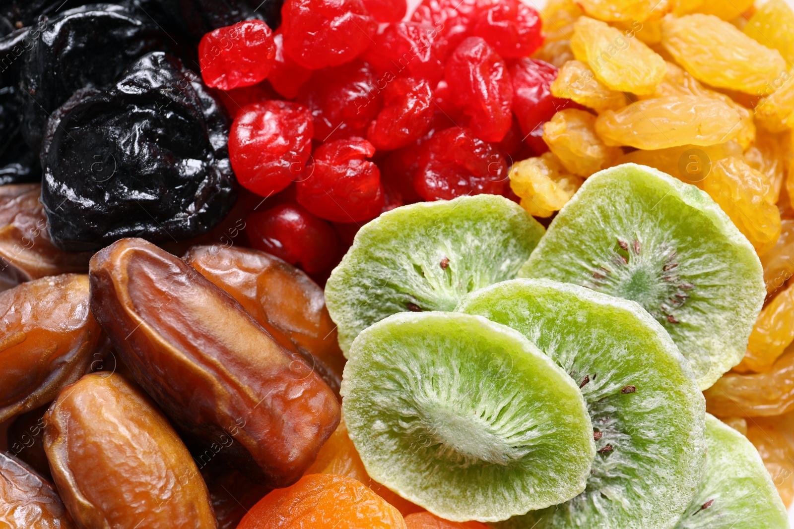 Photo of Different dried fruits as background, closeup. Healthy lifestyle