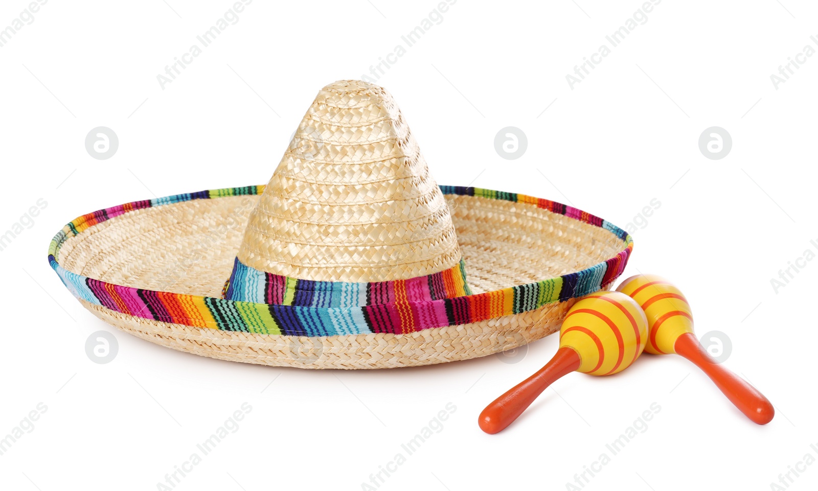 Photo of Mexican sombrero hat and maracas isolated on white