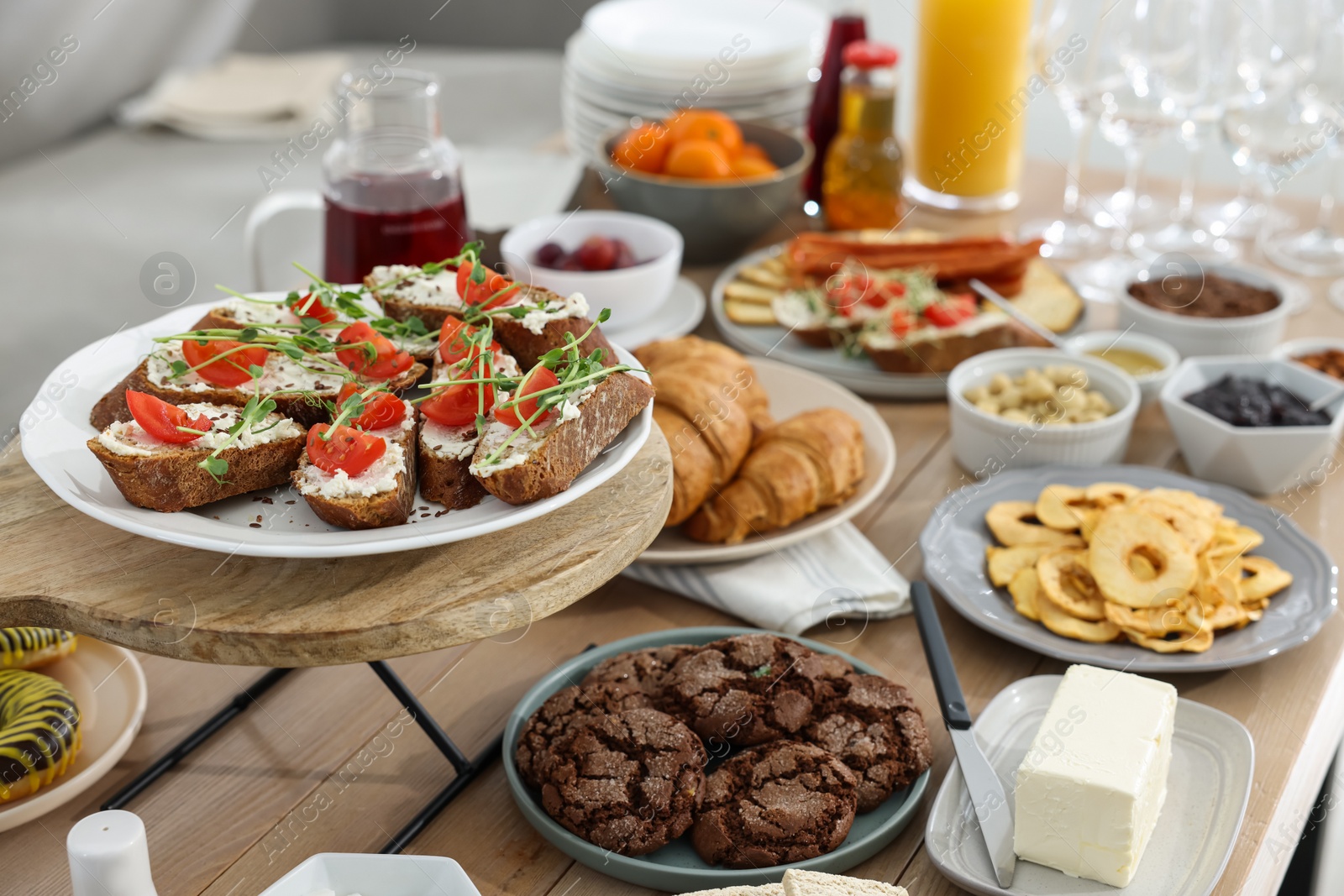 Photo of Brunch table setting with different delicious food indoors