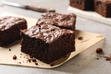 Fresh brownies on table, closeup with space for text. Delicious chocolate pie