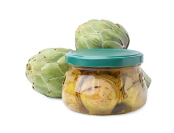Photo of Jar of delicious artichokes pickled in olive oil and fresh vegetables on white background