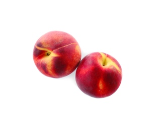 Sweet juicy peaches on white background, top view