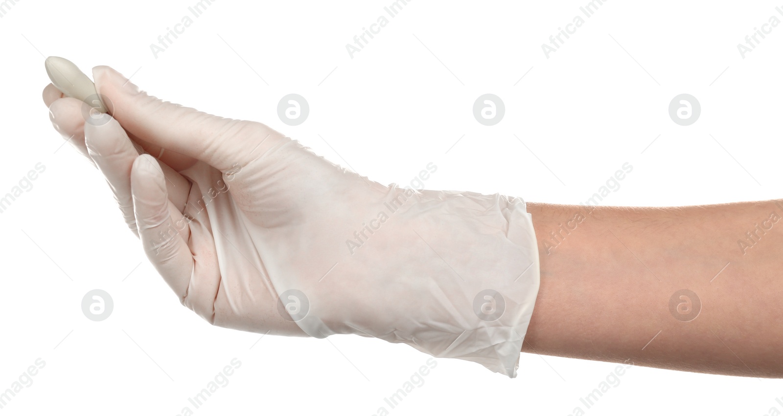 Photo of Doctor holding suppository on white background. Hemorrhoid problems