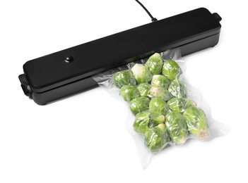 Photo of Sealer for vacuum packing and plastic bag with Brussels sprouts on white background