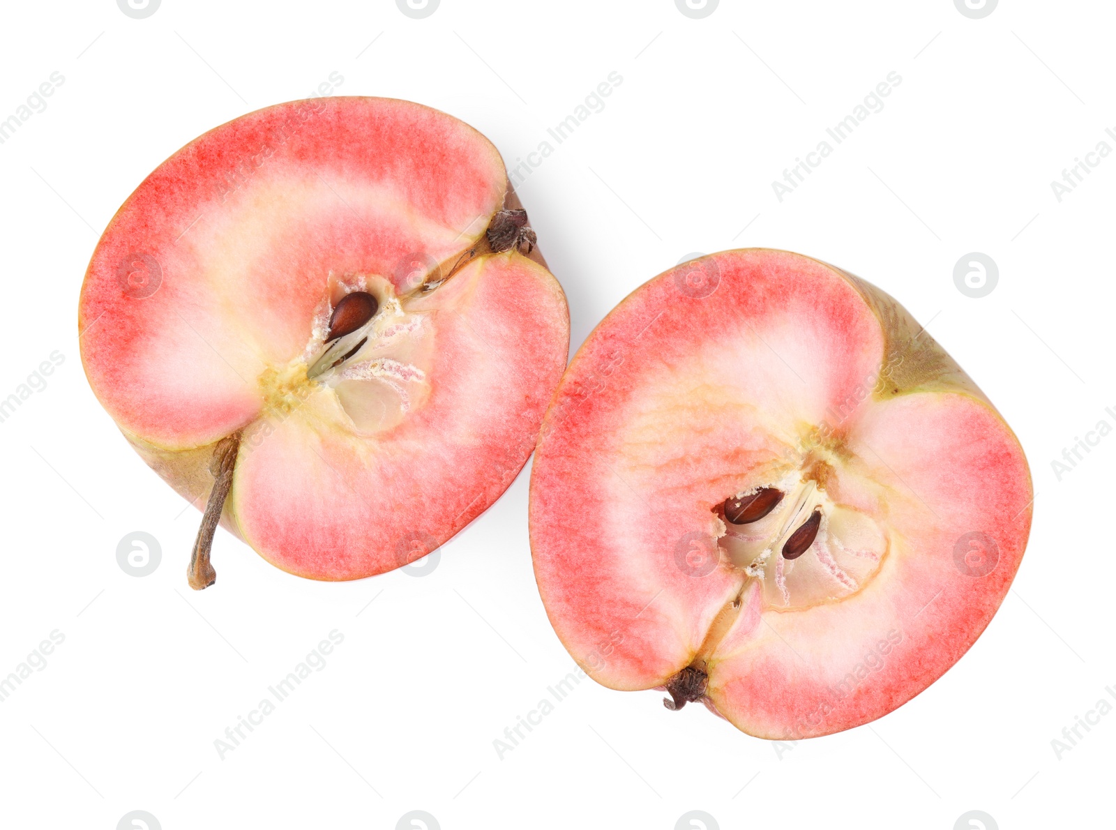 Photo of Halves of apple with red pulp isolated on white, top view