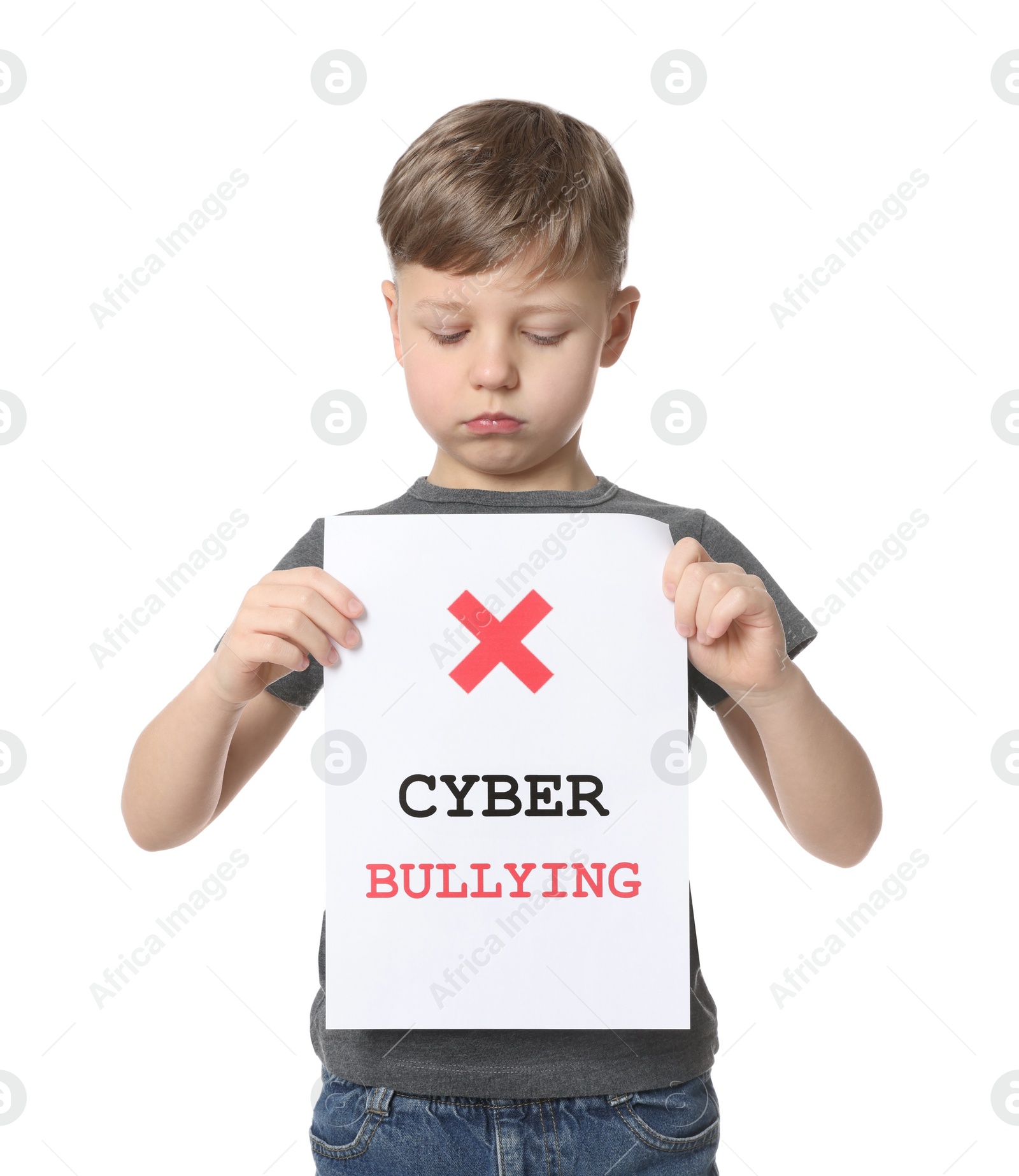 Photo of Boy holding sign with phrase Cyber Bullying on white background