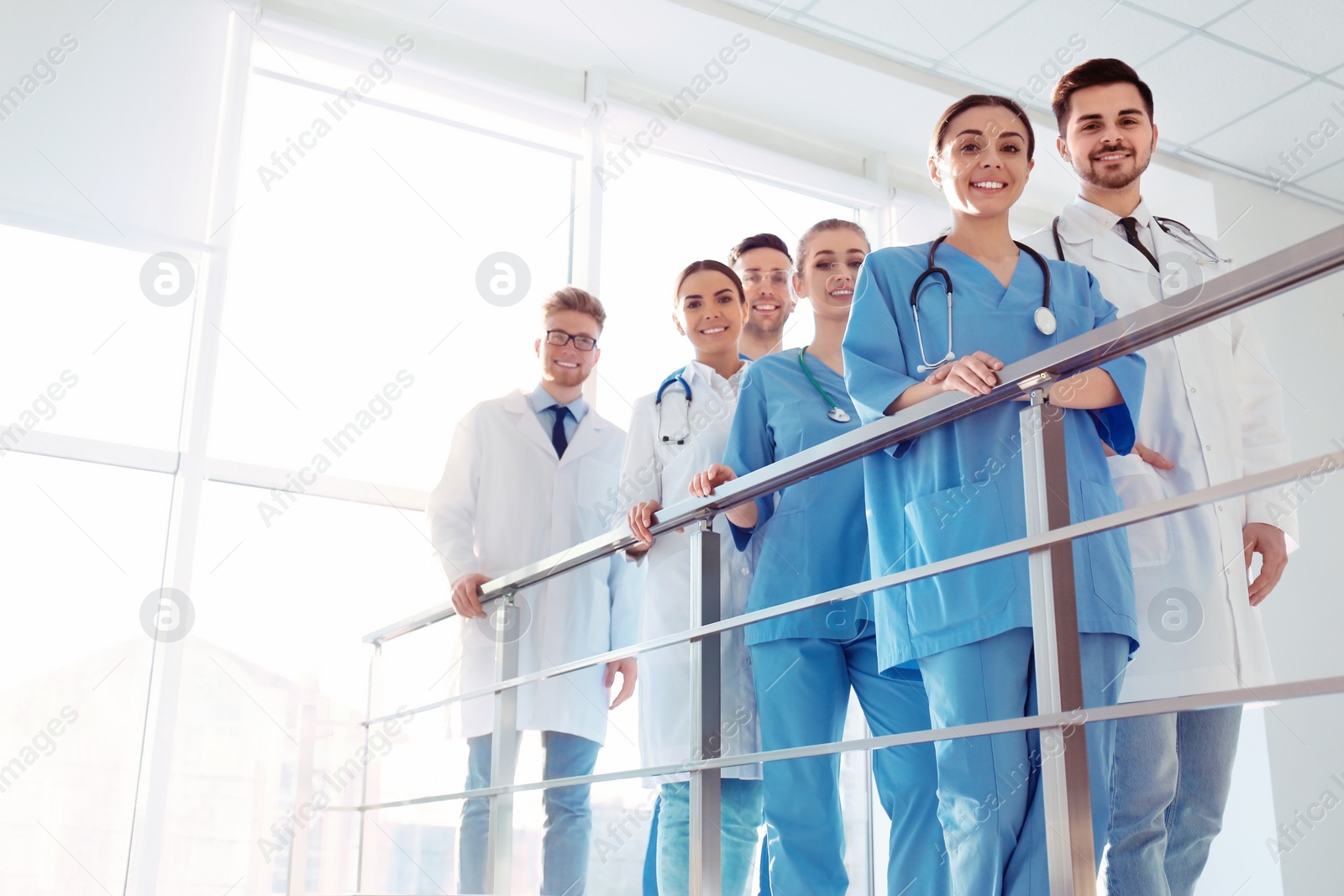 Photo of Group of medical doctors indoors. Unity concept