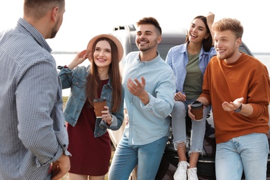 Group of happy people spending time together outdoors