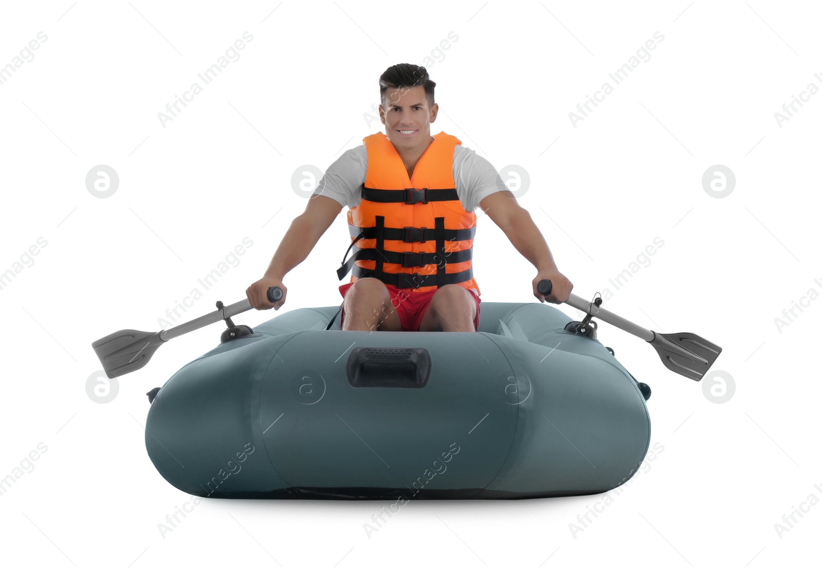 Photo of Man in life vest rowing inflatable rubber boat on white background