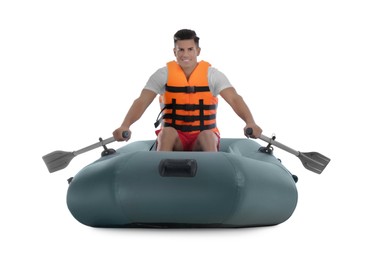 Photo of Man in life vest rowing inflatable rubber boat on white background