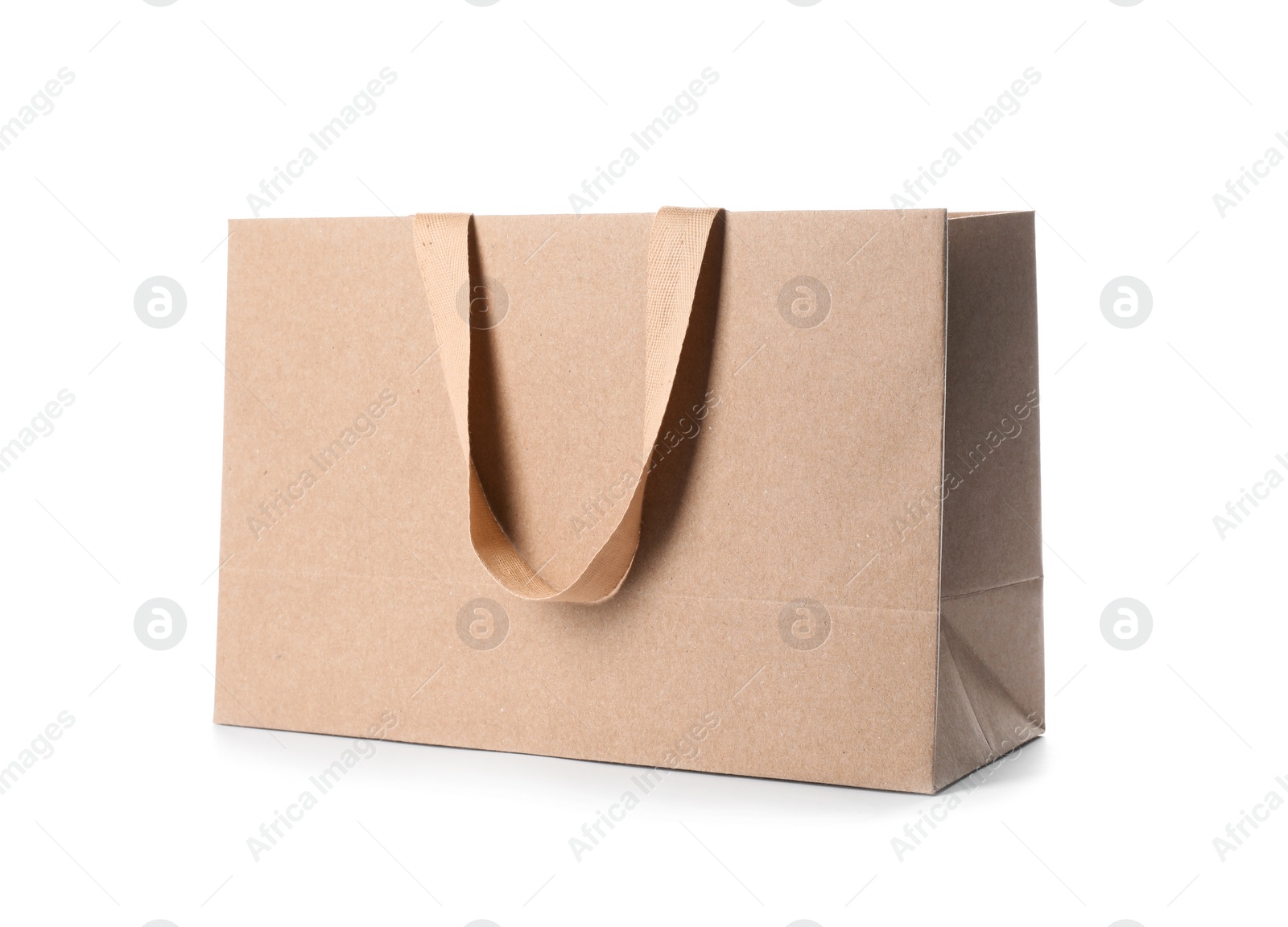 Photo of Paper shopping bag with comfortable handles on white background. Mockup for design