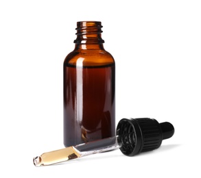 Photo of Cosmetic bottle and pipette with essential oil on white background