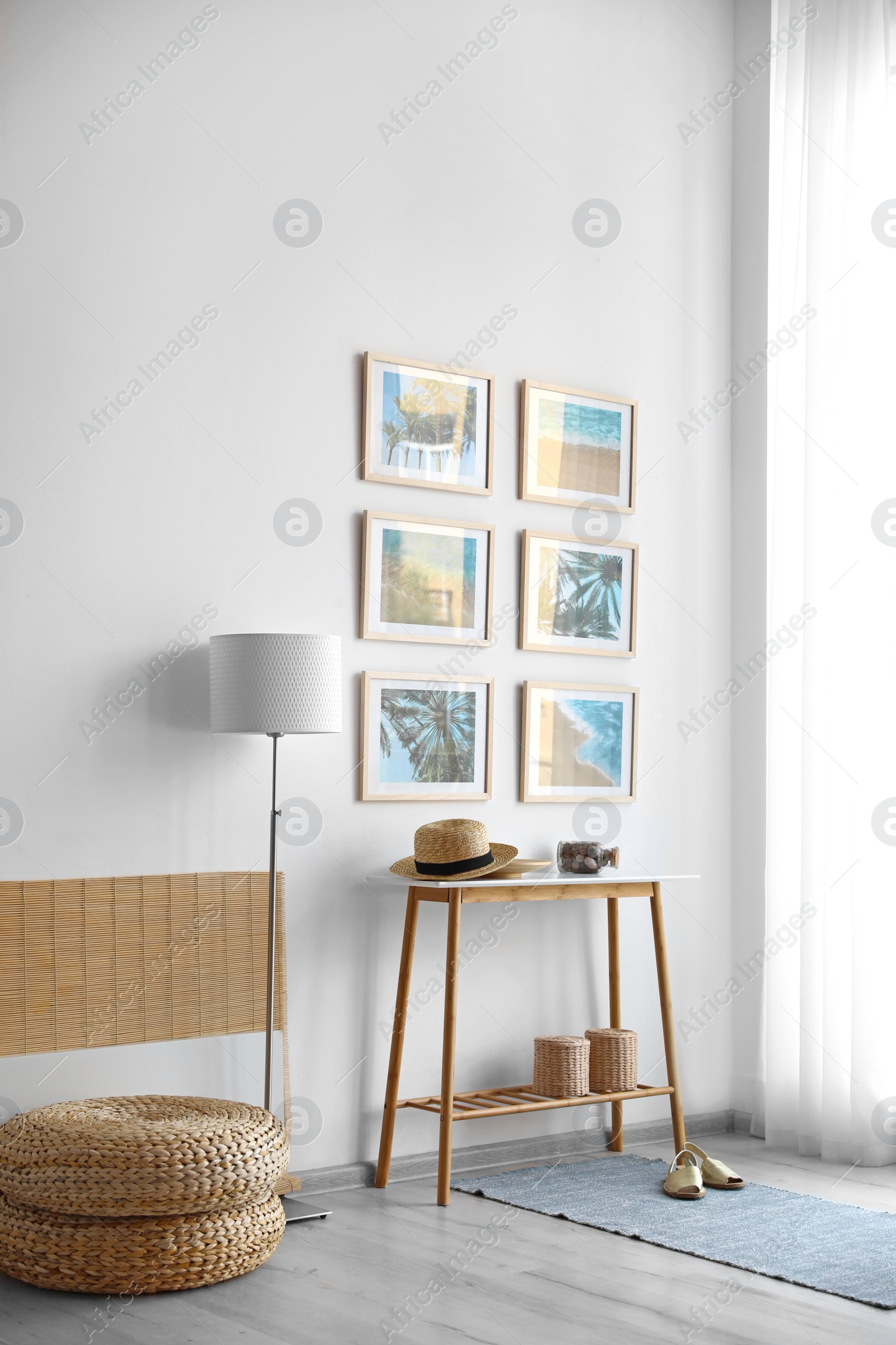 Photo of Stylish room interior with trendy furniture and pictures on wall