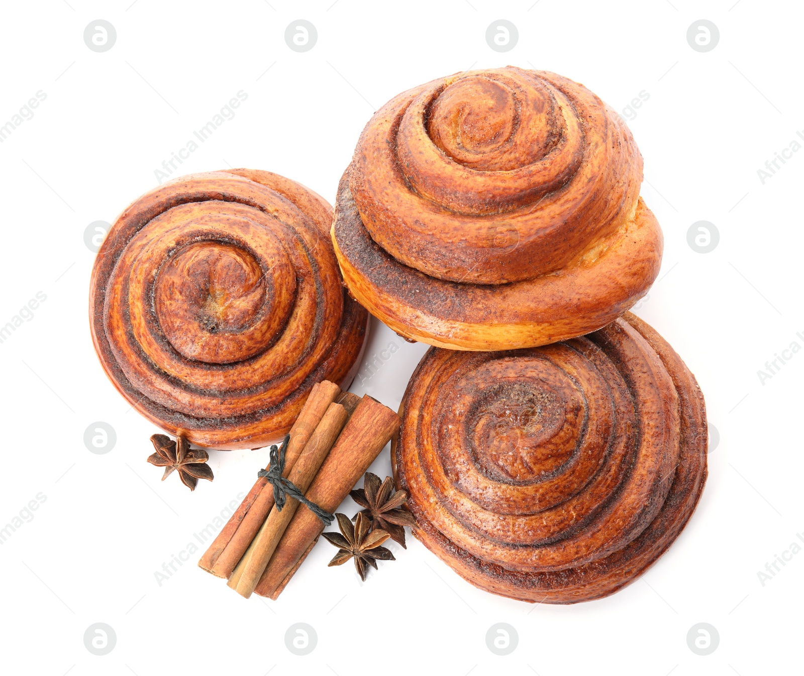 Photo of Freshly baked cinnamon rolls with ingredients on white background, top view