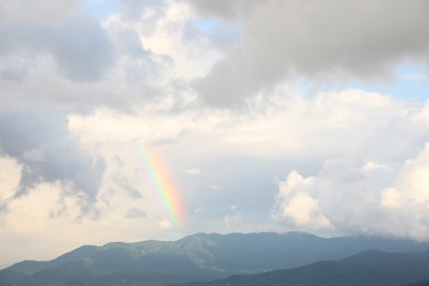 Photo of Picturesque view of sky with heavy rainy clouds and rainbow