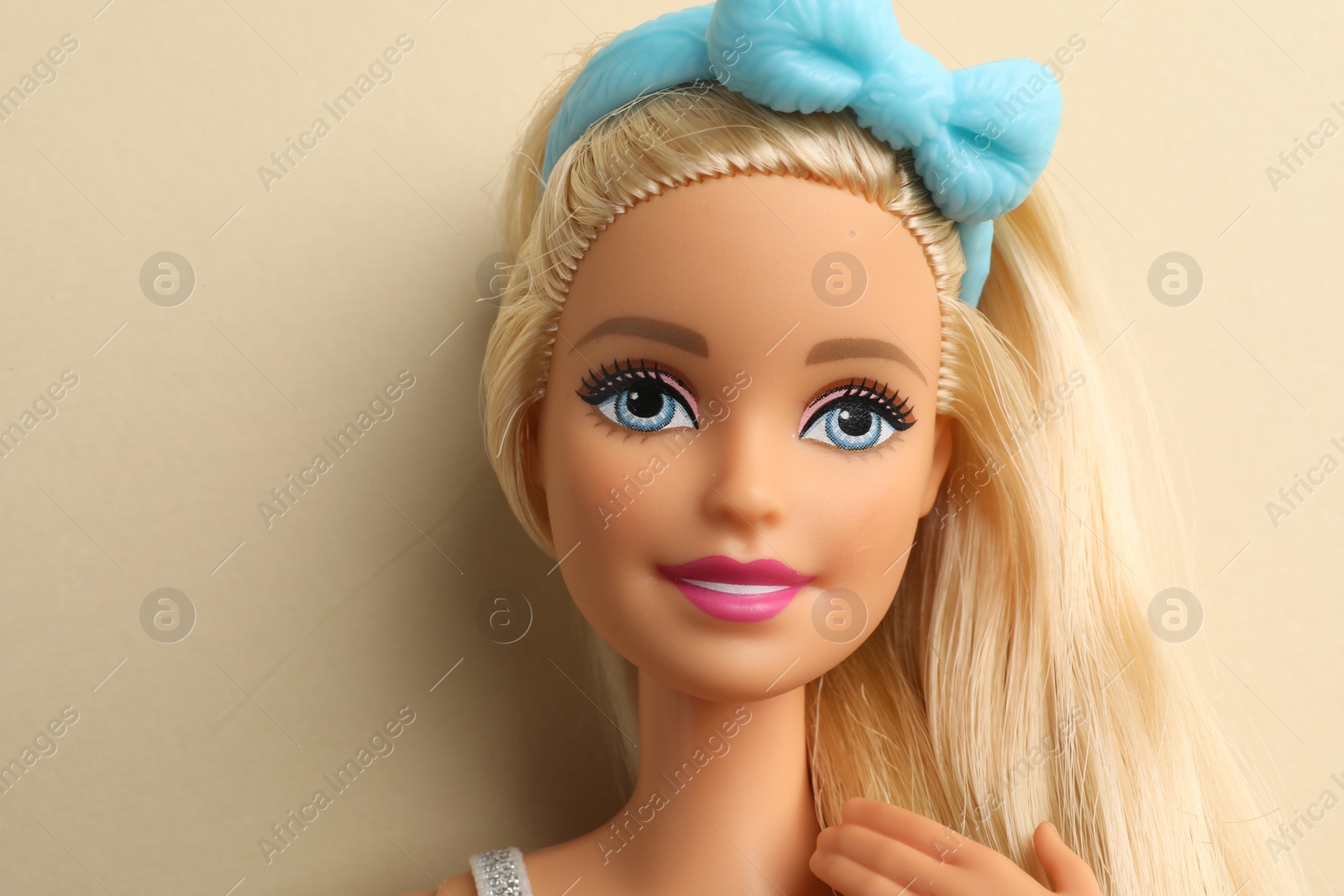 Photo of Mykolaiv, Ukraine - September 4, 2023: Beautiful Barbie doll on beige background, space for text