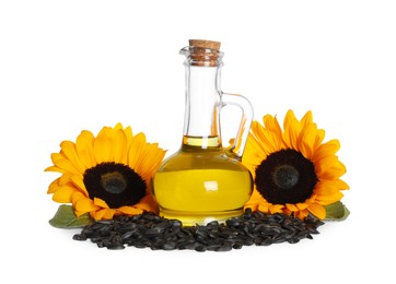 Sunflower cooking oil, seeds and yellow flowers on white background