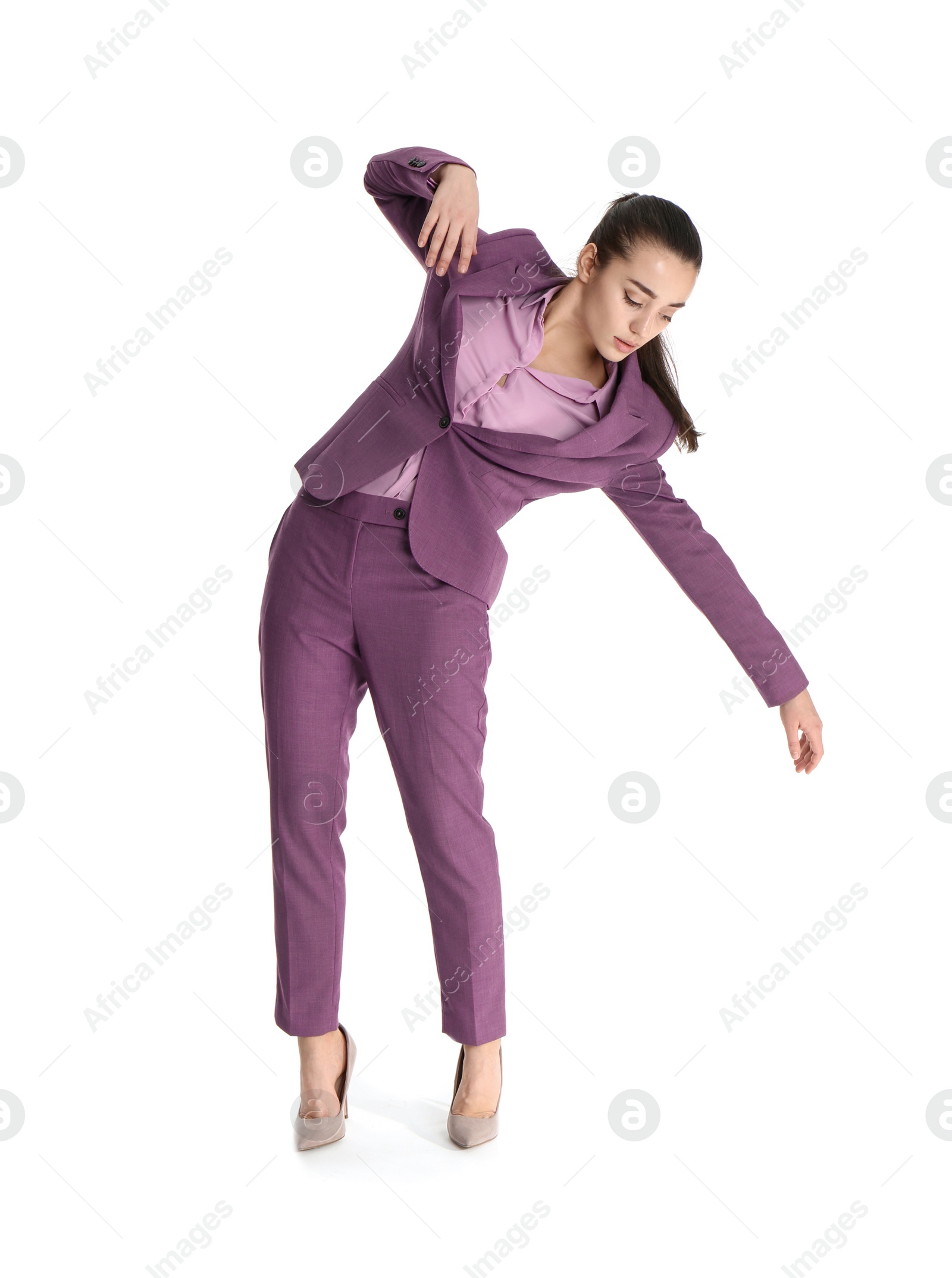 Photo of Businesswoman attracted to magnet on white background