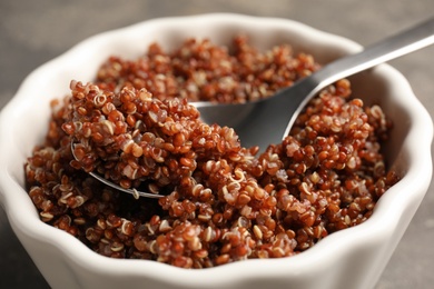 Photo of Closeup view of cooked red quinoa in bowl on table