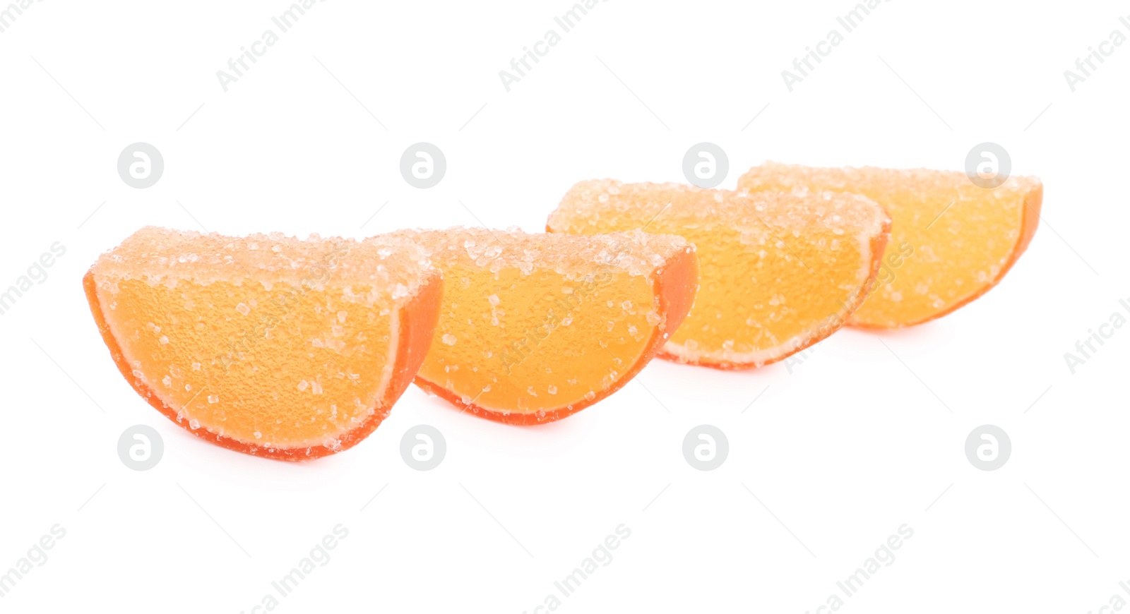 Photo of Sweet orange jelly candies on white background