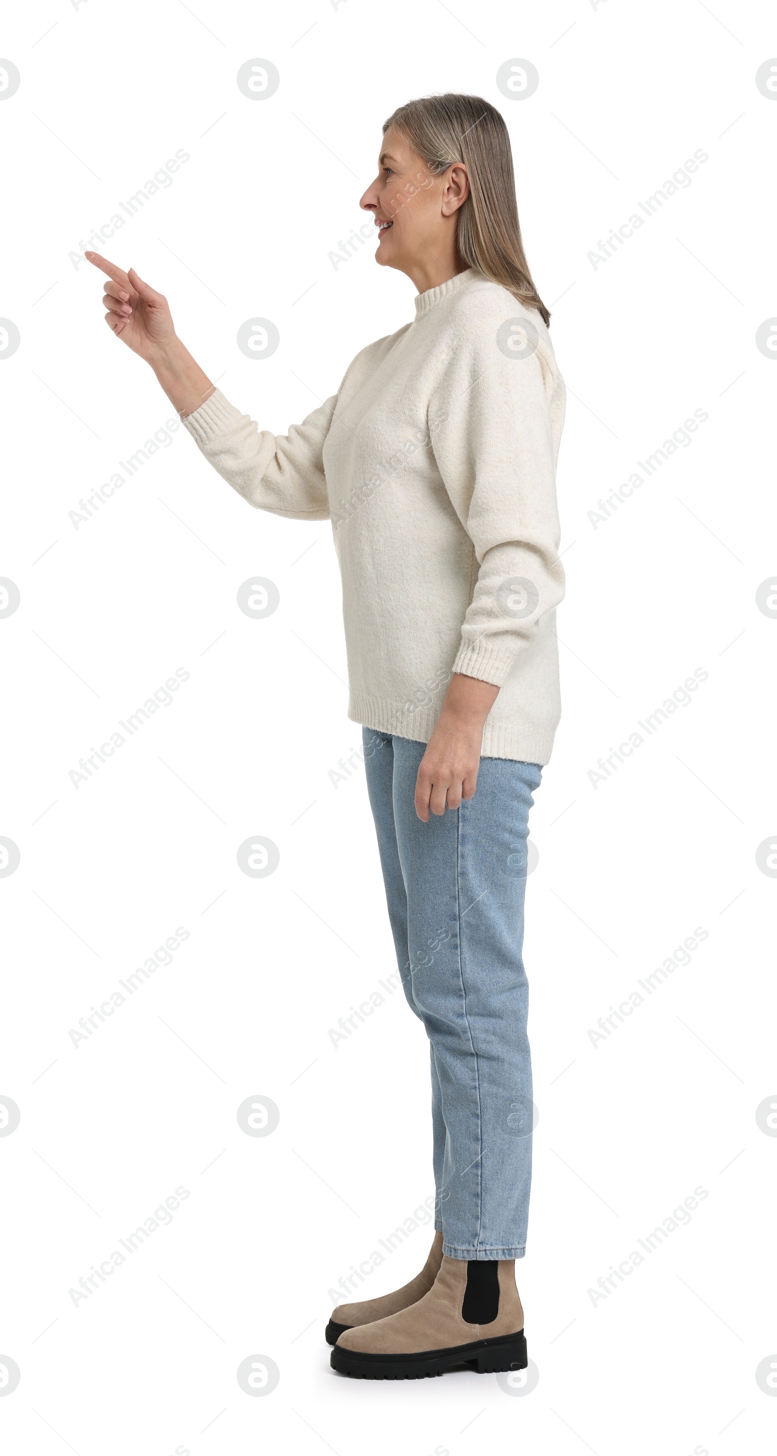 Photo of Senior woman pointing at something on white background