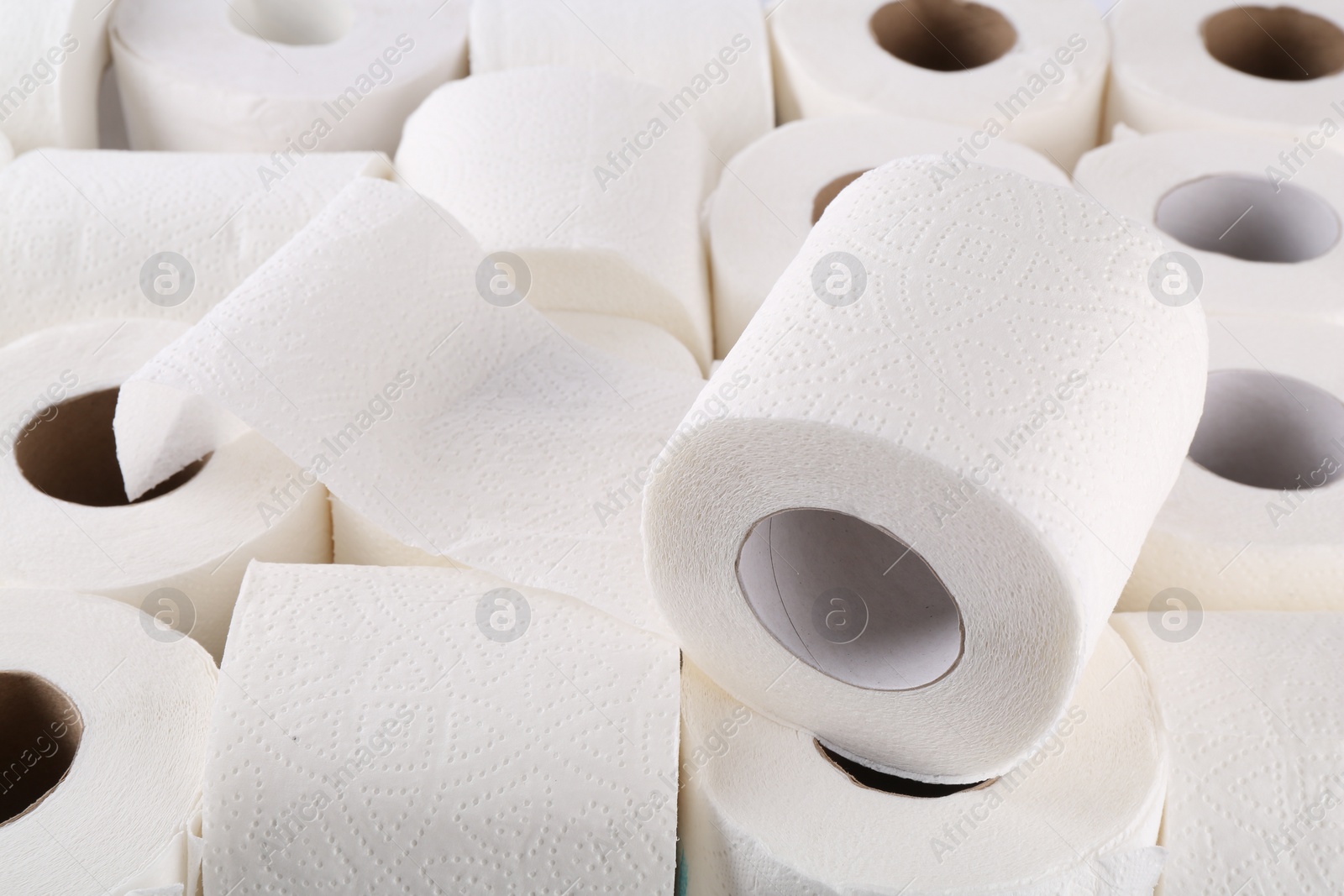 Photo of Many soft toilet paper rolls as background, closeup