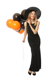 Photo of Beautiful woman wearing witch costume with balloons for Halloween party on white background