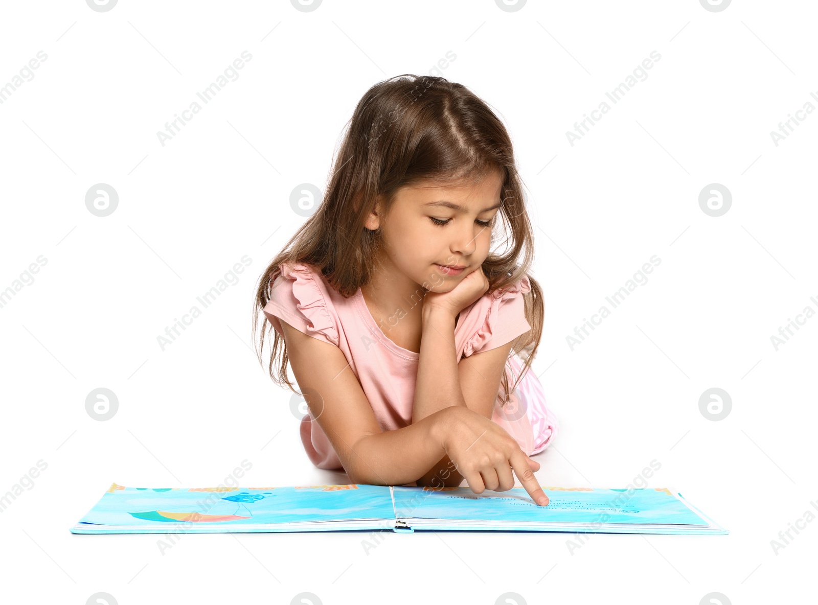 Photo of Cute little girl reading book on white background