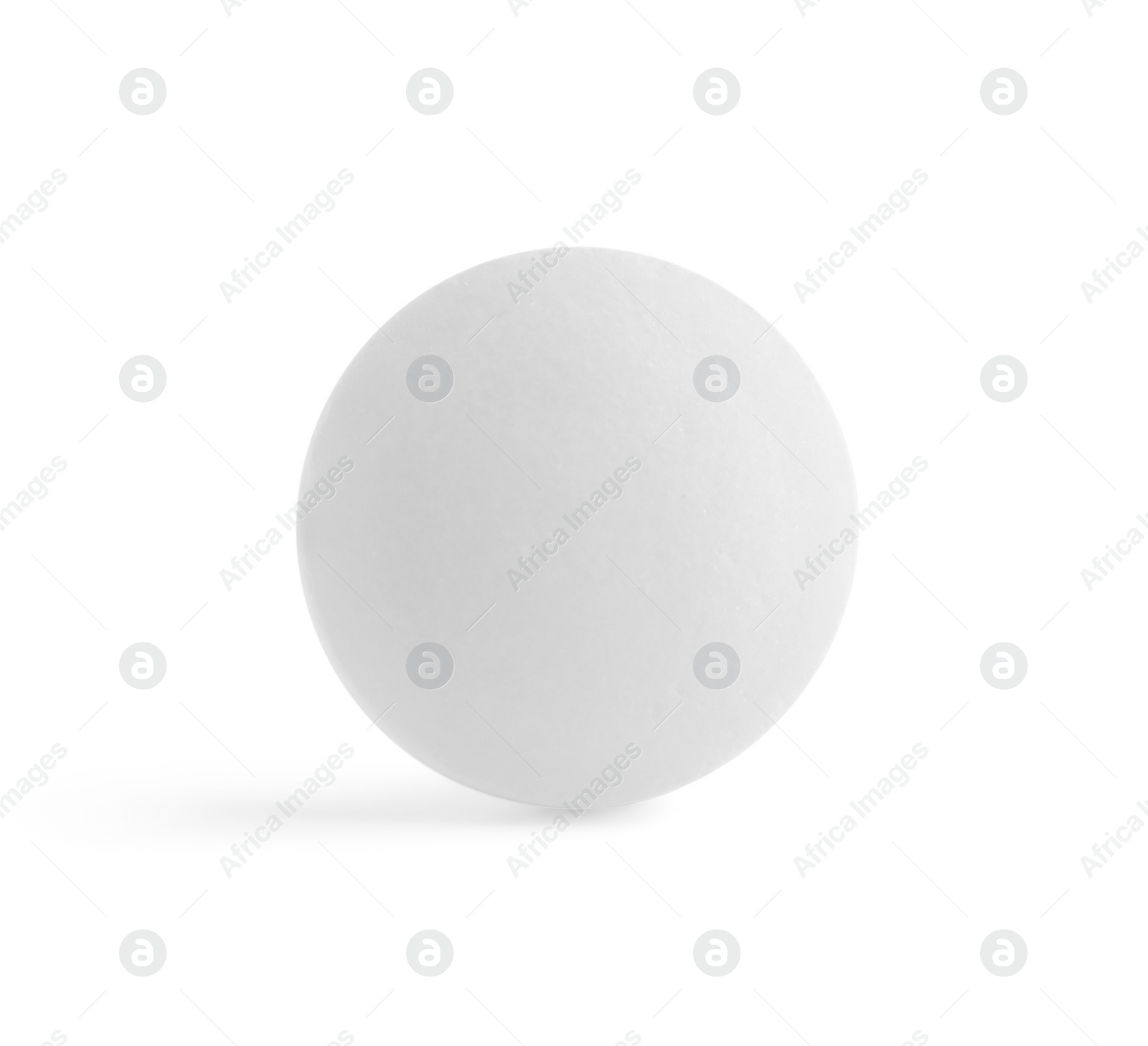 Photo of One round pill on white background. Medicinal treatment