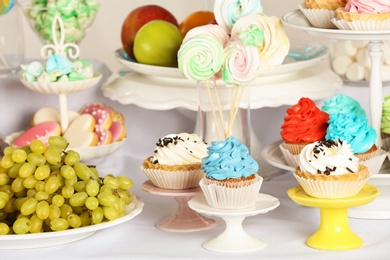 Photo of Delicious treats served on table at candy bar, closeup