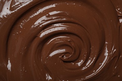 Photo of Tasty milk chocolate paste as background, top view